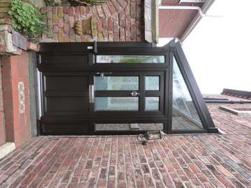 Oxton : Wirral : Design and build Black ash PvcU Porch complete with Evolution storm front door glazed with a Pilkington Glass Oriol Colletion sandblasted glass